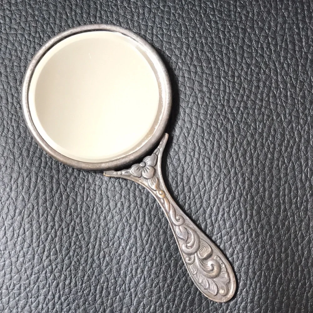 Antique petite hand mirror
